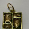 Hand made pendant crafted from green and gold ink and resin set in gold metal window bezel.