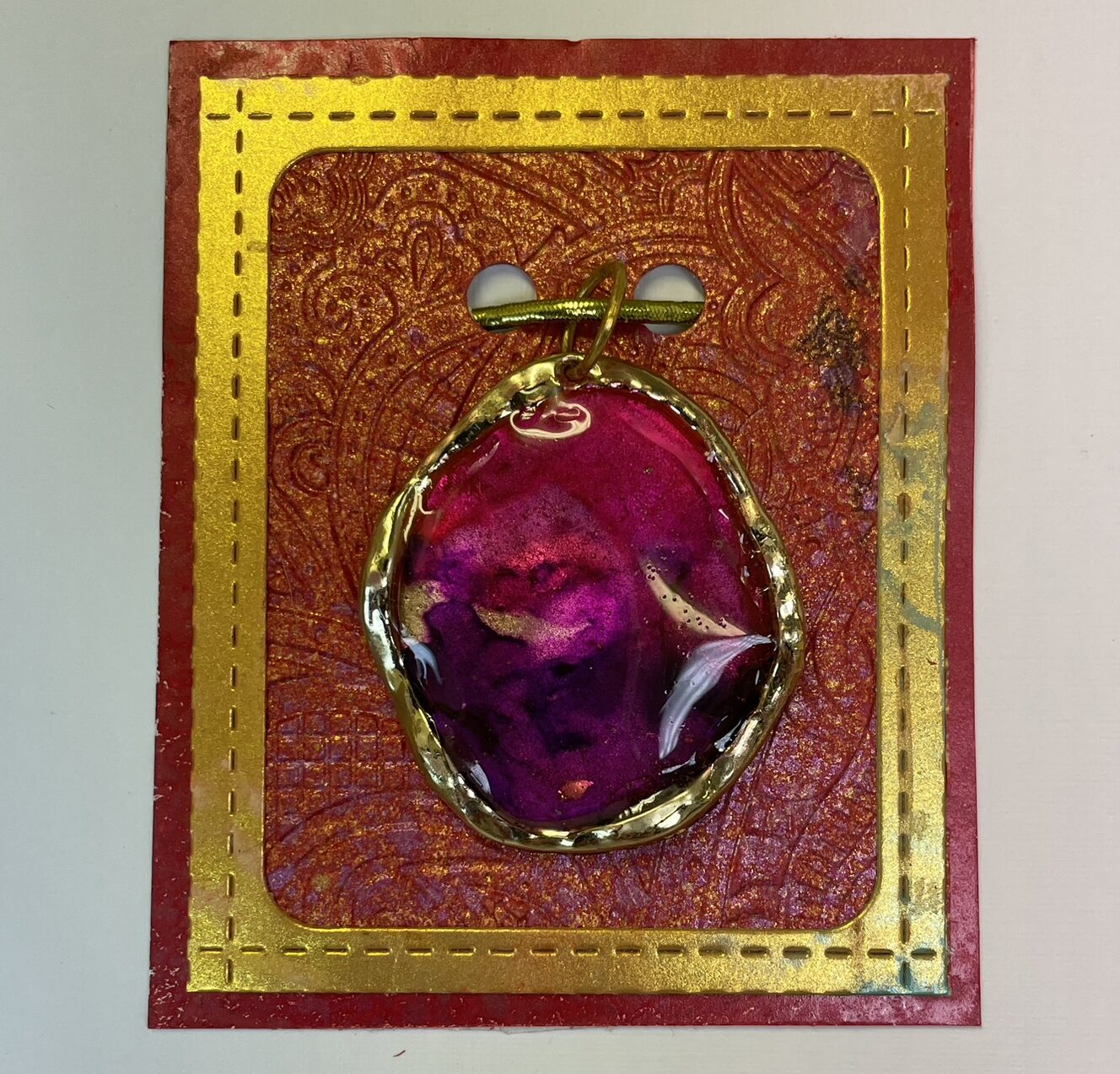 Hand crafted pendant in red pink and purple