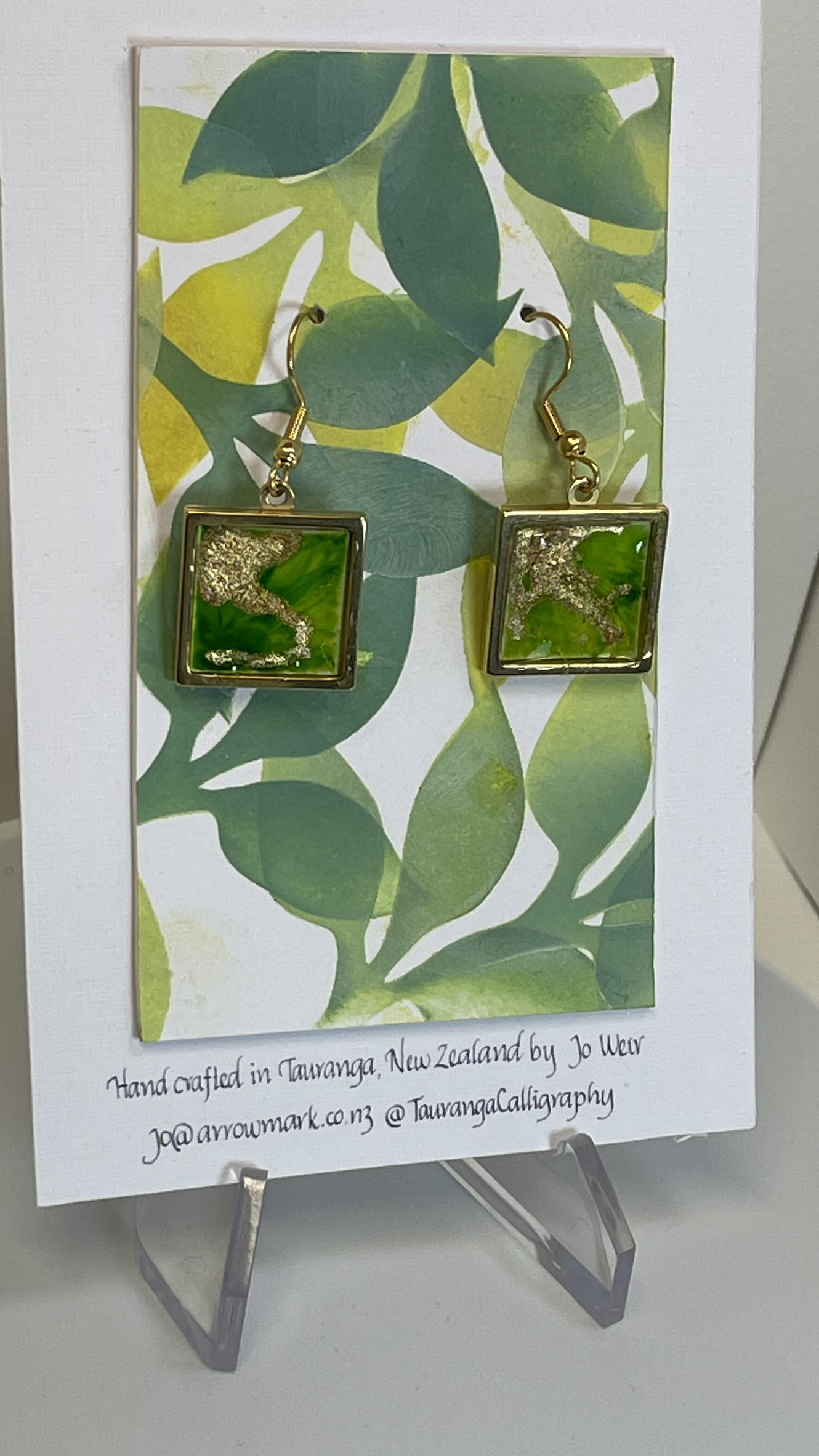 Earrings: green and gold inks in square gold metal bezels