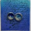 Gift: Cufflinks in blue and white set in silver-coloured bezels and domed with resin