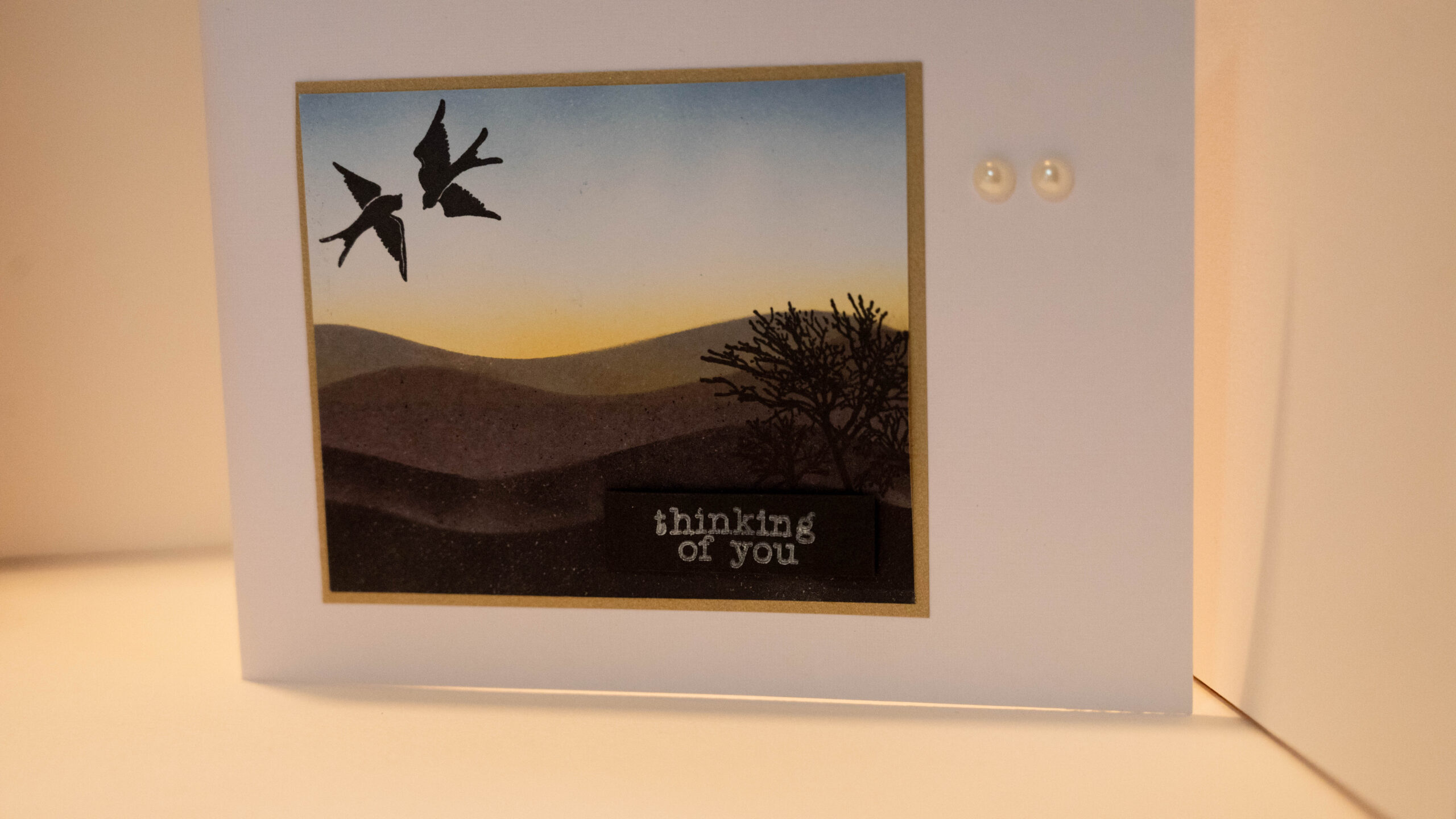 Hand crafted card featuring sunset landscape and a sentiment to let the recipient know they're in your thoughts