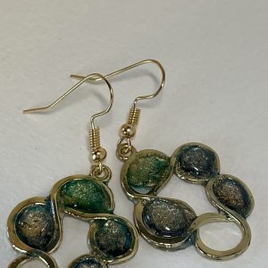Hand made earrings crafted from ink and resin set in gold wreath-shaped bezels.