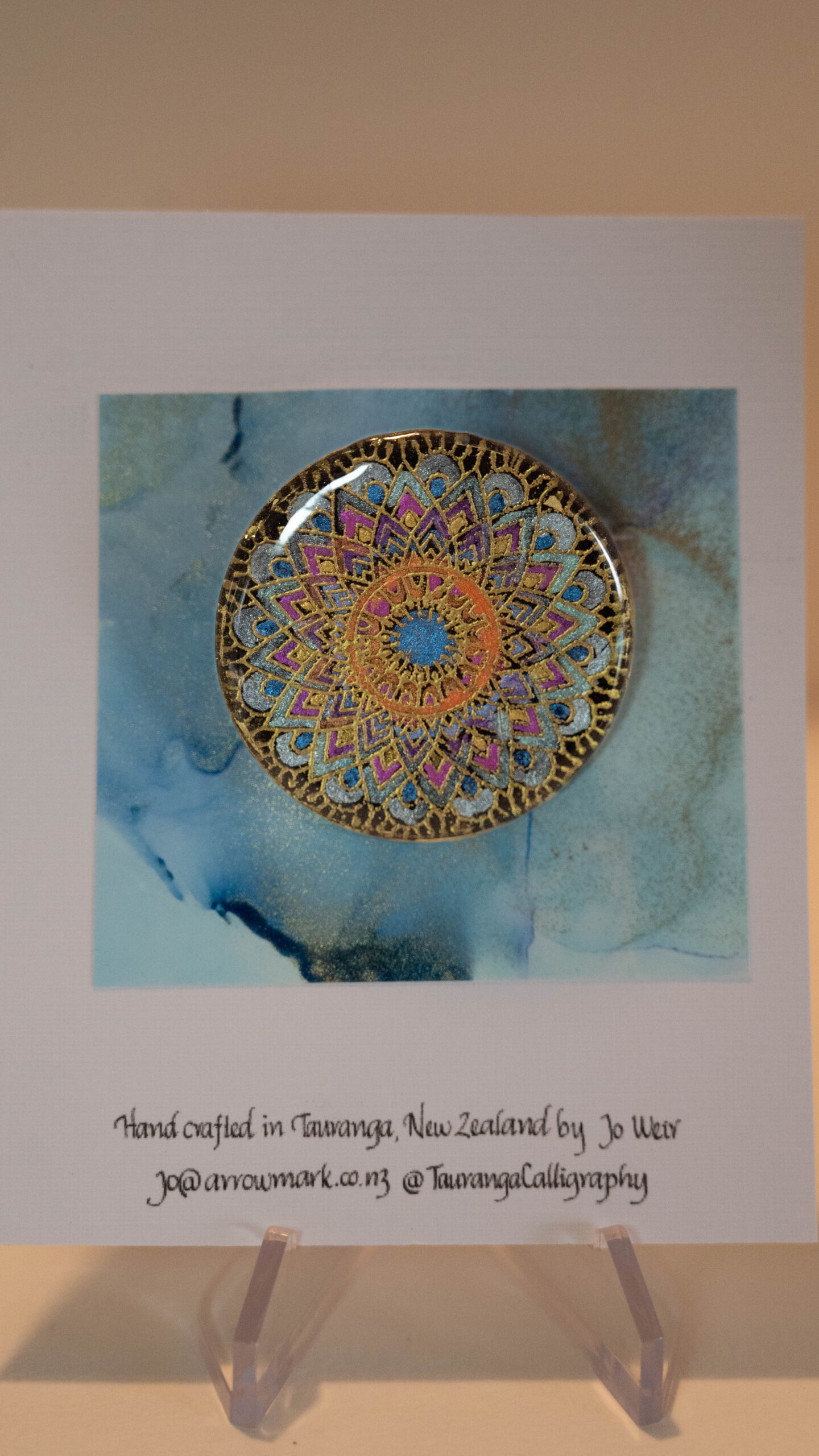 Tauranga jewellery: Mandala brooch in oranges pinks and blues