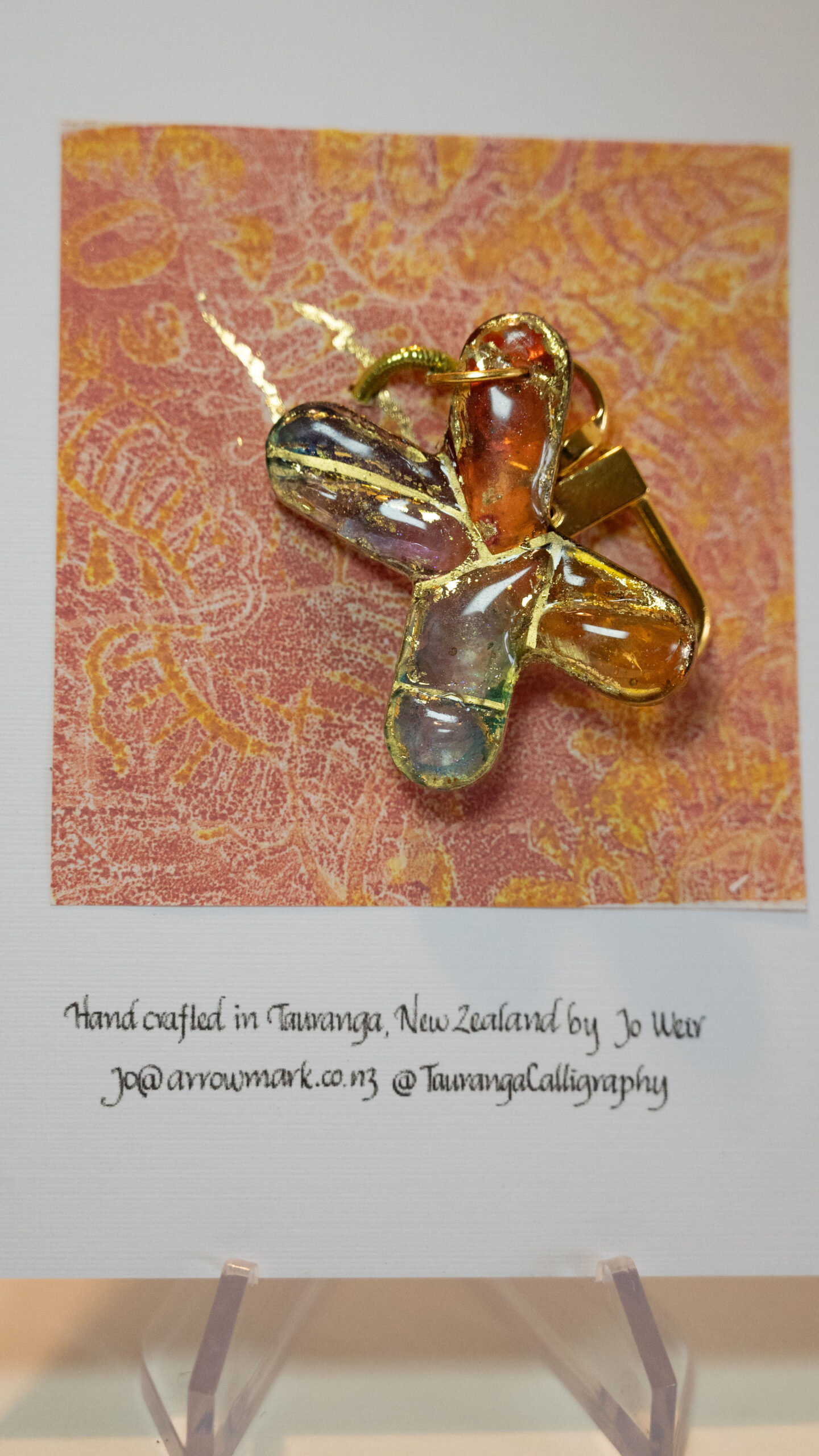 Hand crafted keyring in the letter X hand featuring alcohol inks, resin and gold ink. 