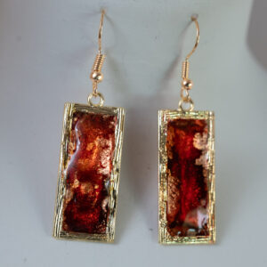 Tauranga jewellery: Earrings: Oblong gold bezels filled with red and gold ink and resin