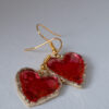 Tauranga Jewellery: Hand made earrings featuring red and gold inks and resin set in gold coloured heart shaped bezels