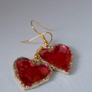 Tauranga Jewellery: Hand made earrings featuring red and gold inks and resin set in gold coloured heart shaped bezels