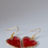 Tauranga Jewellery: Hand made earrings featuring red and gold inks and resin set in gold coloured heart shaped bezels