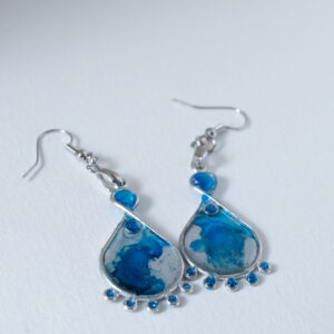 Tauranga Jewellery: Hand made earrings featuring blue and silver inks and resin set in silver coloured bezels