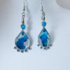 Tauranga Jewellery: Hand made earrings featuring blue and silver inks and resin set in silver coloured bezels