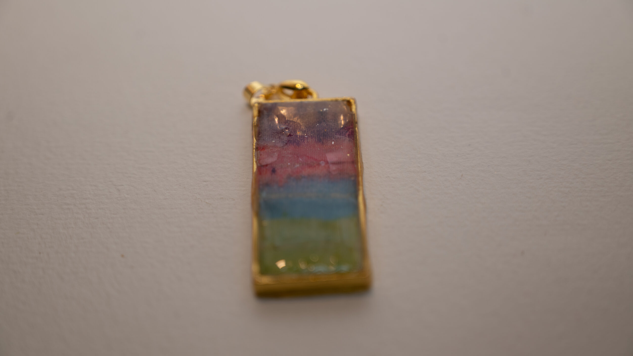 Tauranga Jewellery: Pendant hand crafted from tissue, alcohol ink and resin