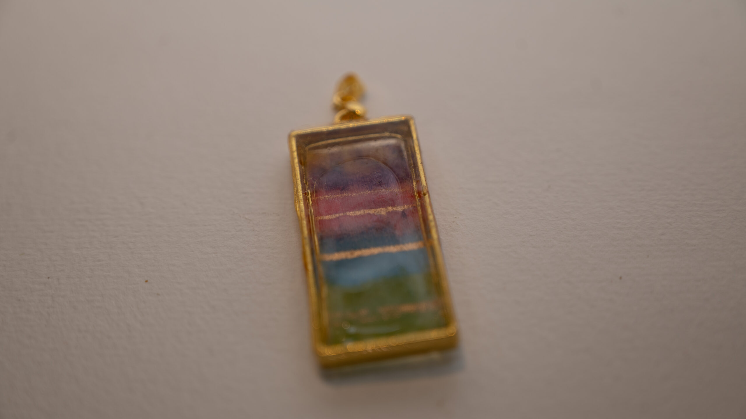 Tauranga Jewellery: Pendant hand crafted from tissue, alcohol ink and resin