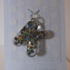 Key ring: Letter KOne of a kind, hand made in Tauranga, New Zealand. Ideal for a person whose name starts with K. Sparkly hologram hearts encased in resin.  Other letters can be made in this style, or this letter can be made in other styles. Please contact us for options.