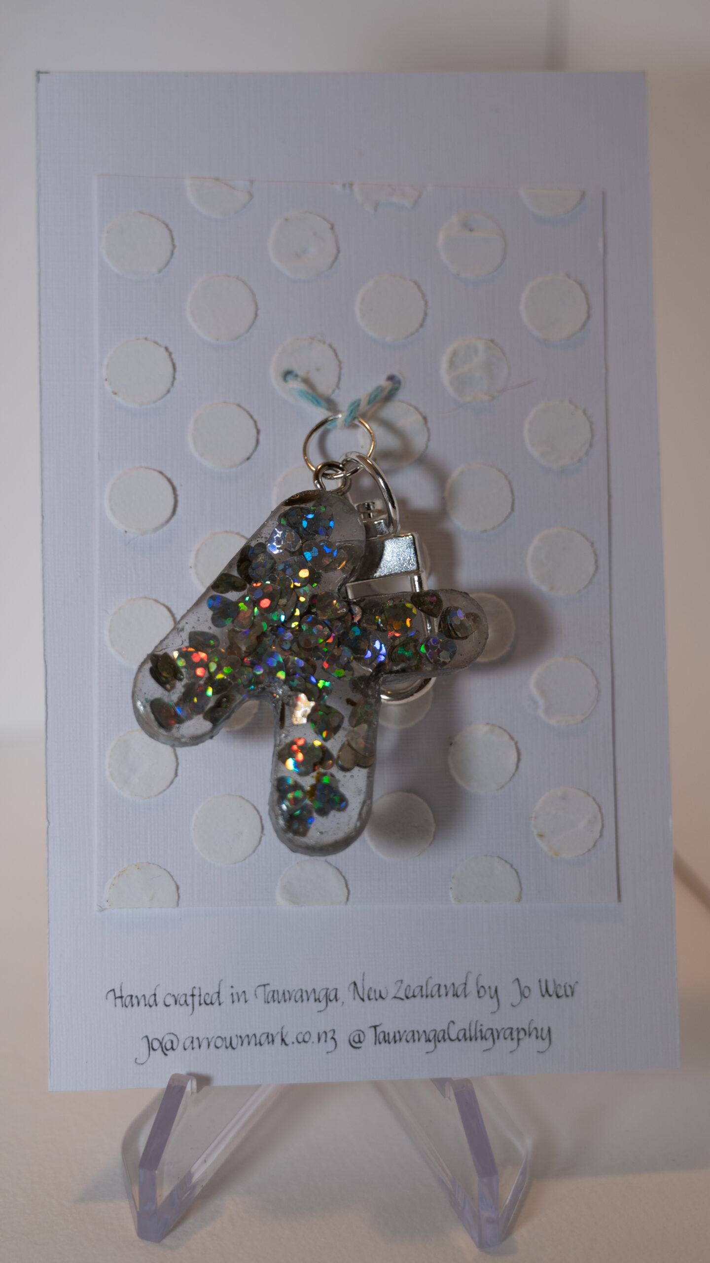 Key ring: Letter KOne of a kind, hand made in Tauranga, New Zealand. Ideal for a person whose name starts with K. Sparkly hologram hearts encased in resin.  Other letters can be made in this style, or this letter can be made in other styles. Please contact us for options.