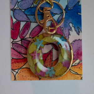 One of a kind, hand made in Tauranga, New Zealand. Ideal for a person whose name starts with O. Hand made miniature flowers encased in resin. Other letters can be made in this style, or this letter can be made in other styles. Please contact us for options.