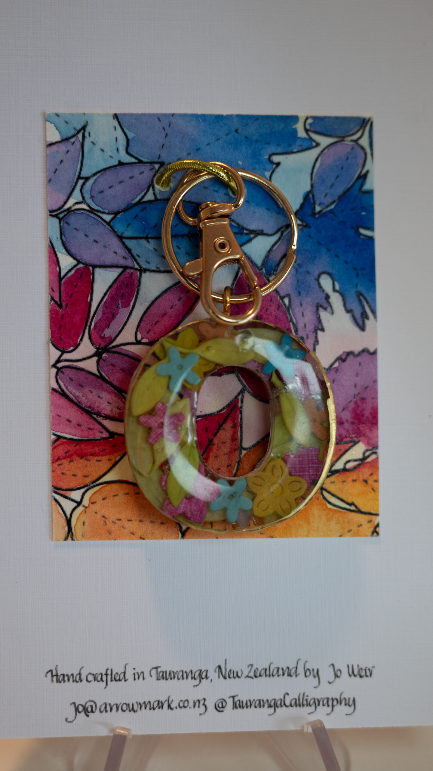 Gift: Key ring letter O One of a kind, hand made in Tauranga, New Zealand. Ideal for a person whose name starts with O. Hand made miniature flowers encased in resin. Other letters can be made in this style, or this letter can be made in other styles. Please contact us for options.