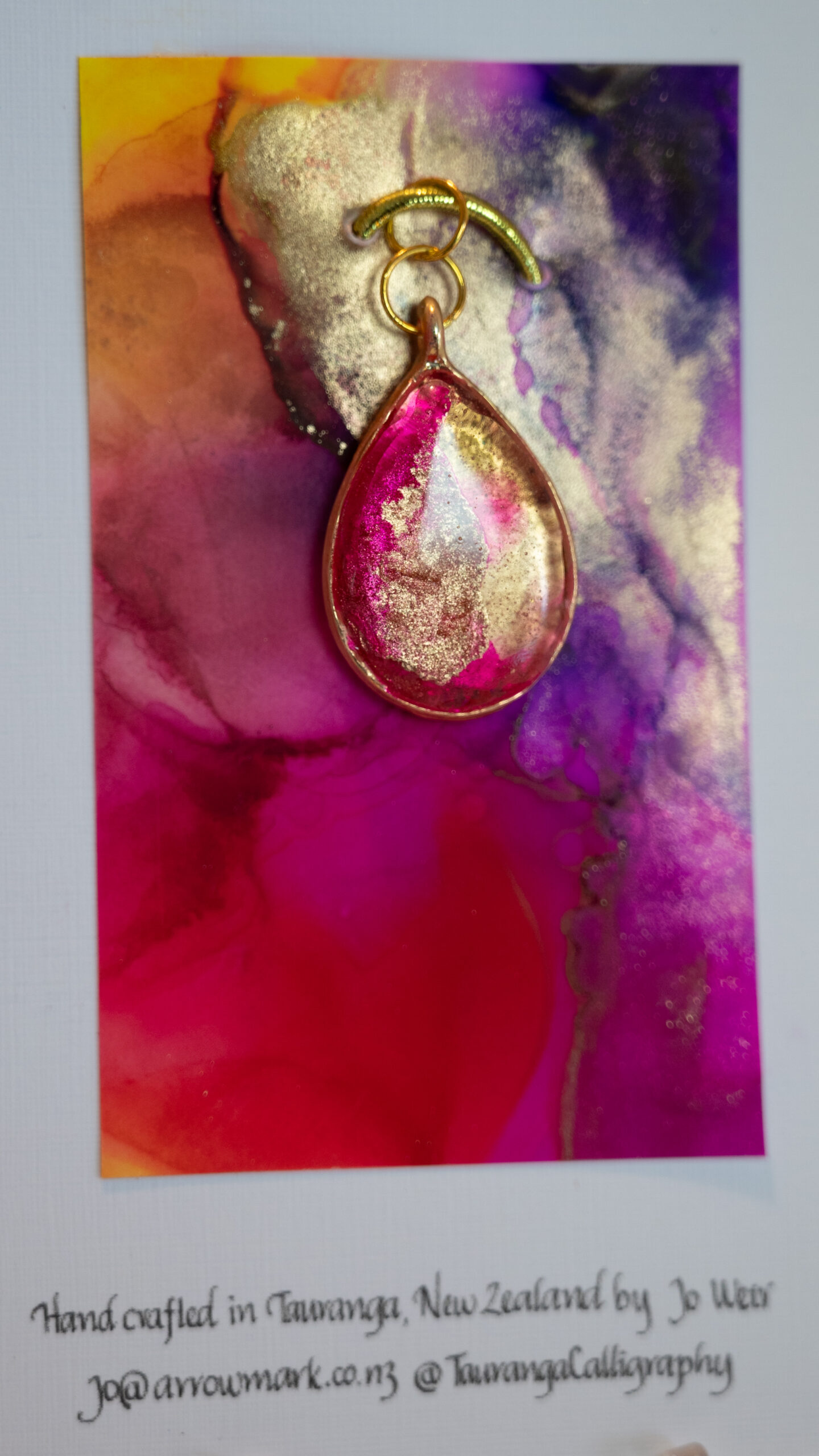 Hand made tear drop shaped pendant in pinks and golds
