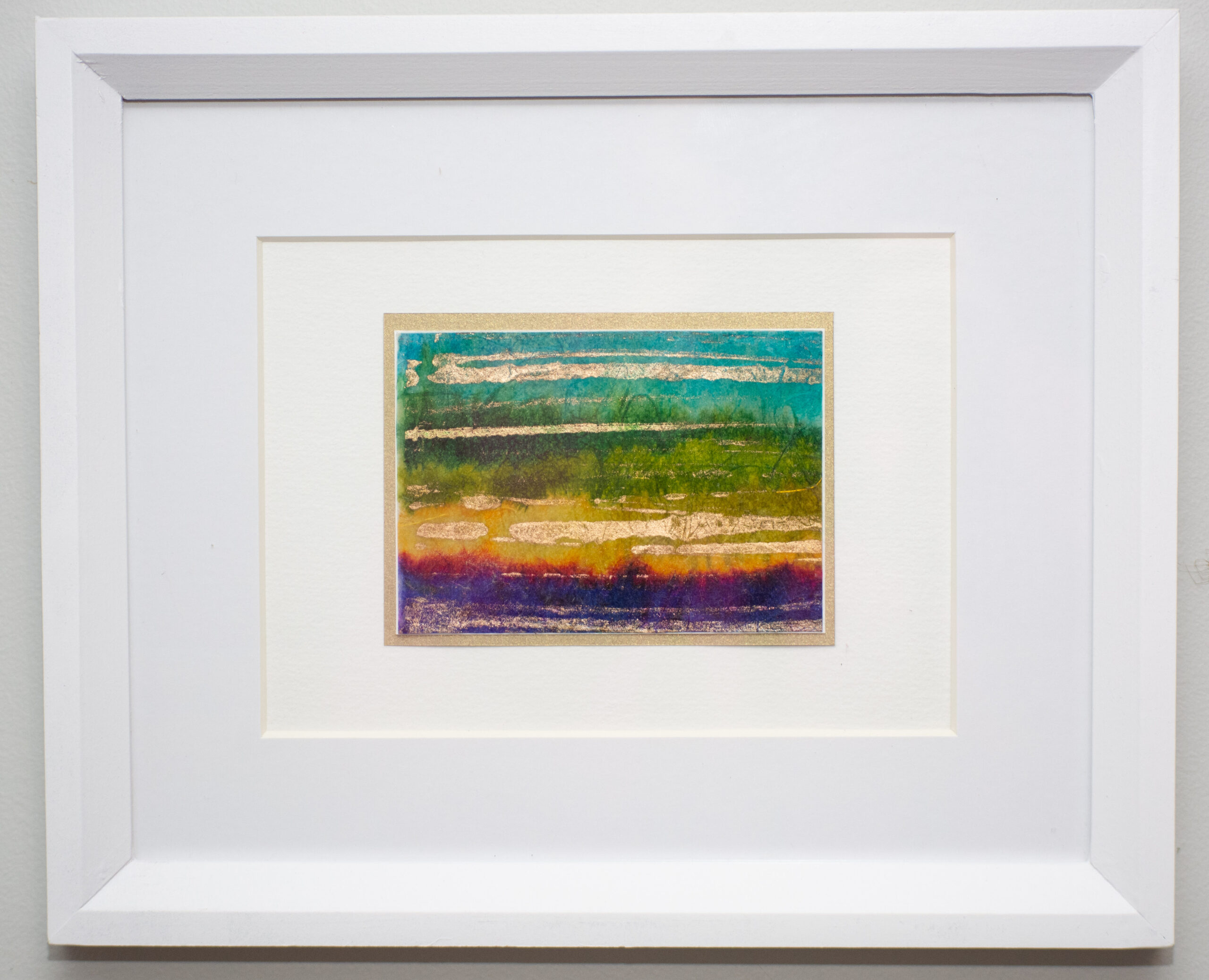 This piece is very bright, crafted by hand painting inks on handmade Japanese paper, featuring metallic gold highlights.