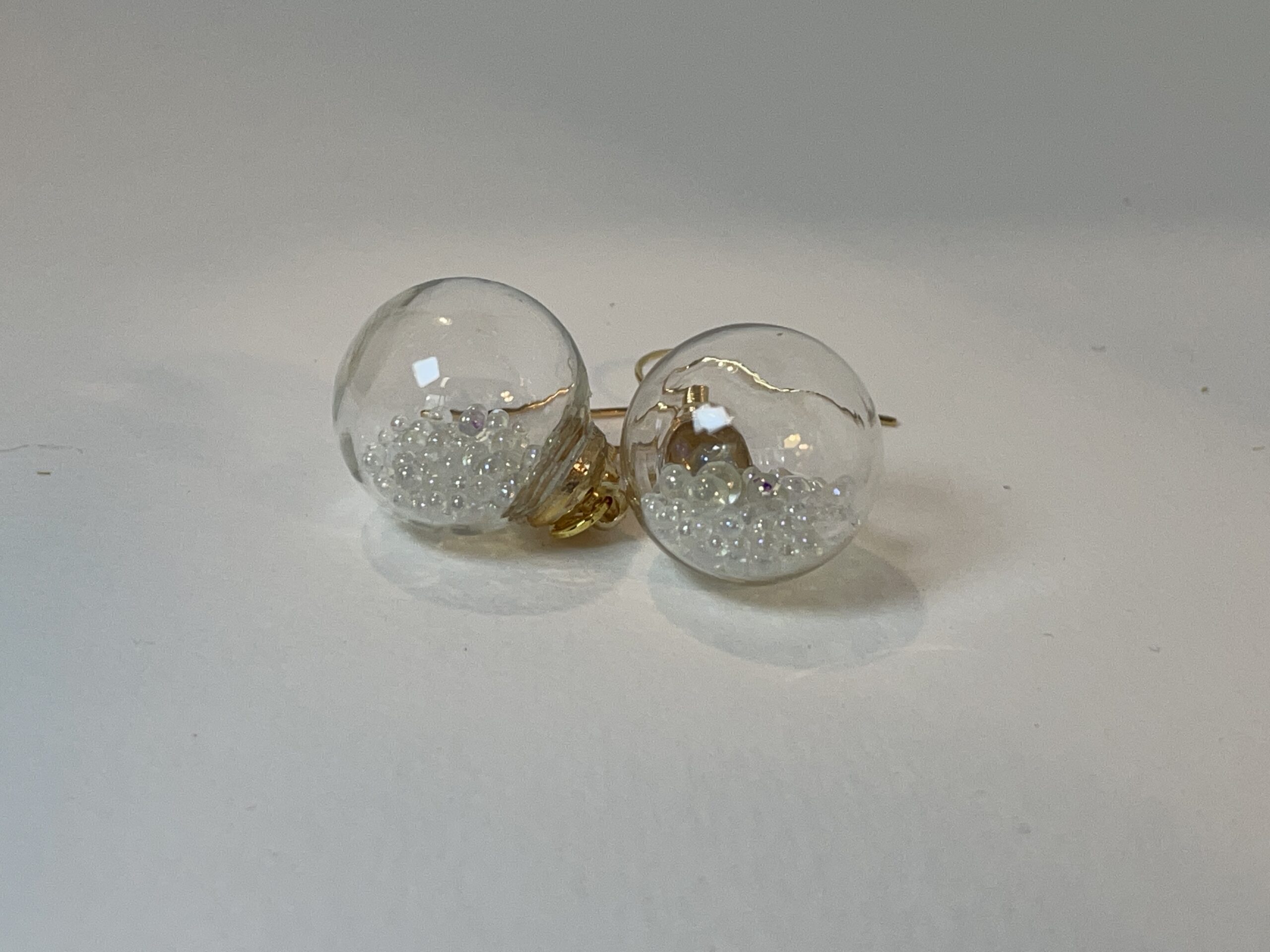 Perfect for the festive season, these sparkly, dangly earrings are mini tree ornaments filled with tiny bubbles  Very special and unusual.  NZ MADE