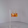 Jewellery: Earrings. Gold metalframes with orange, red and yellow windows.