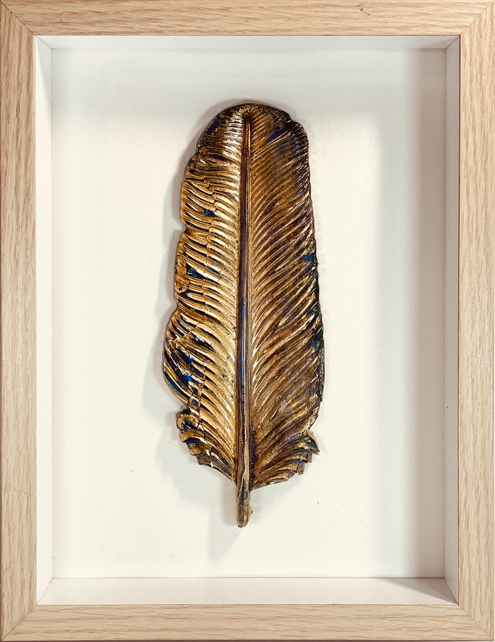 Hand made feather in blue and green and gold