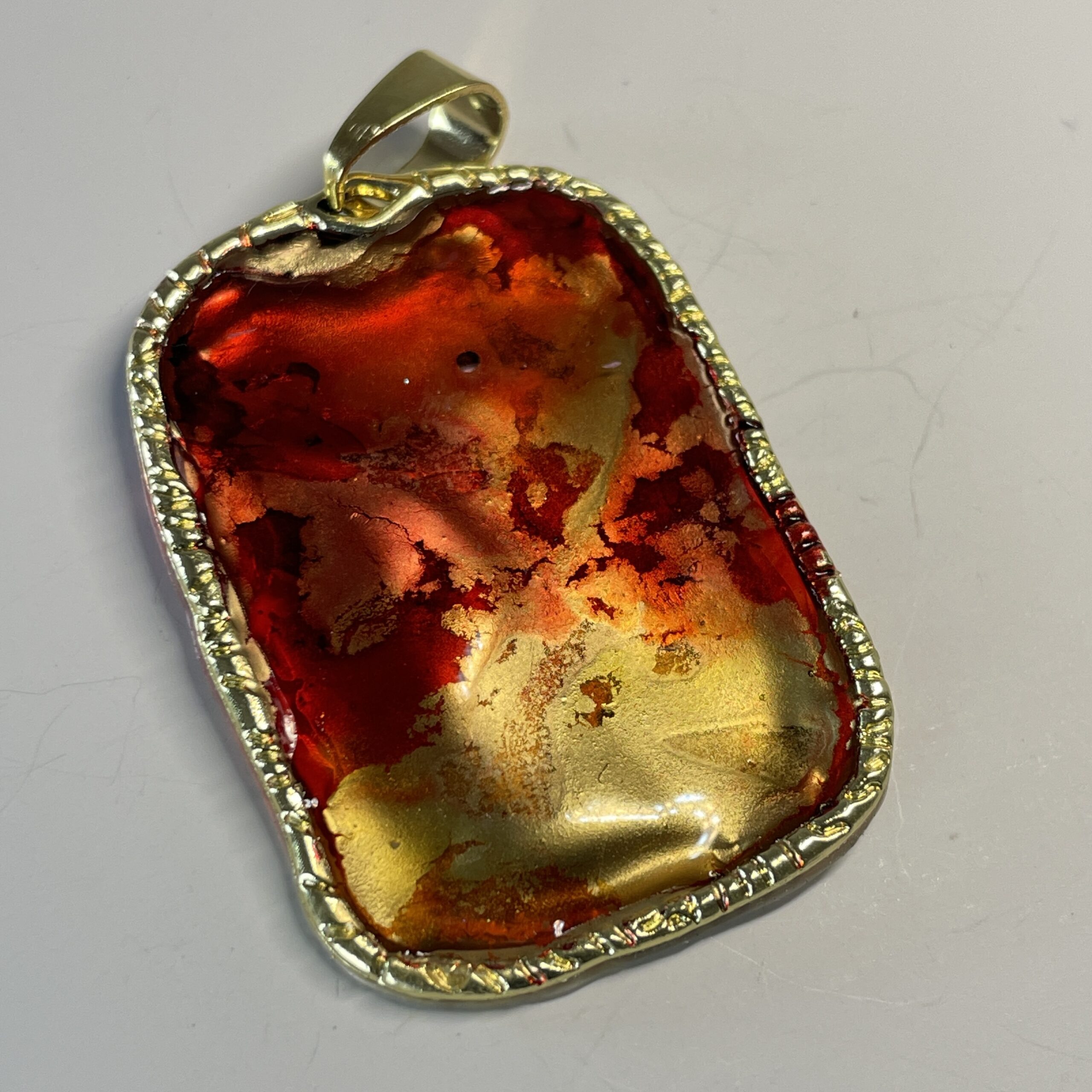 Hand made pendant in red, yellow and gold