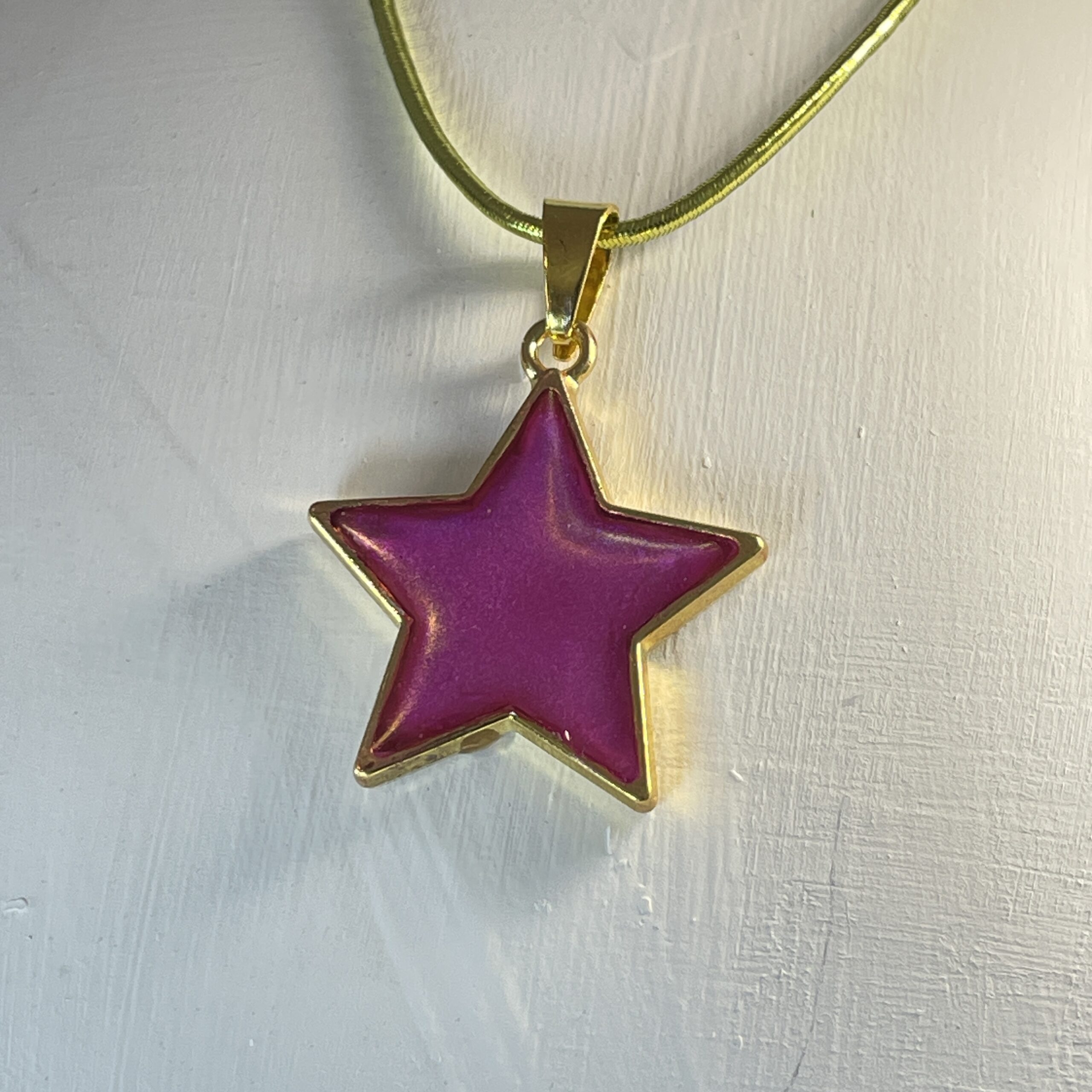 A sparkly pink star pendant perfect for Mother's Day.