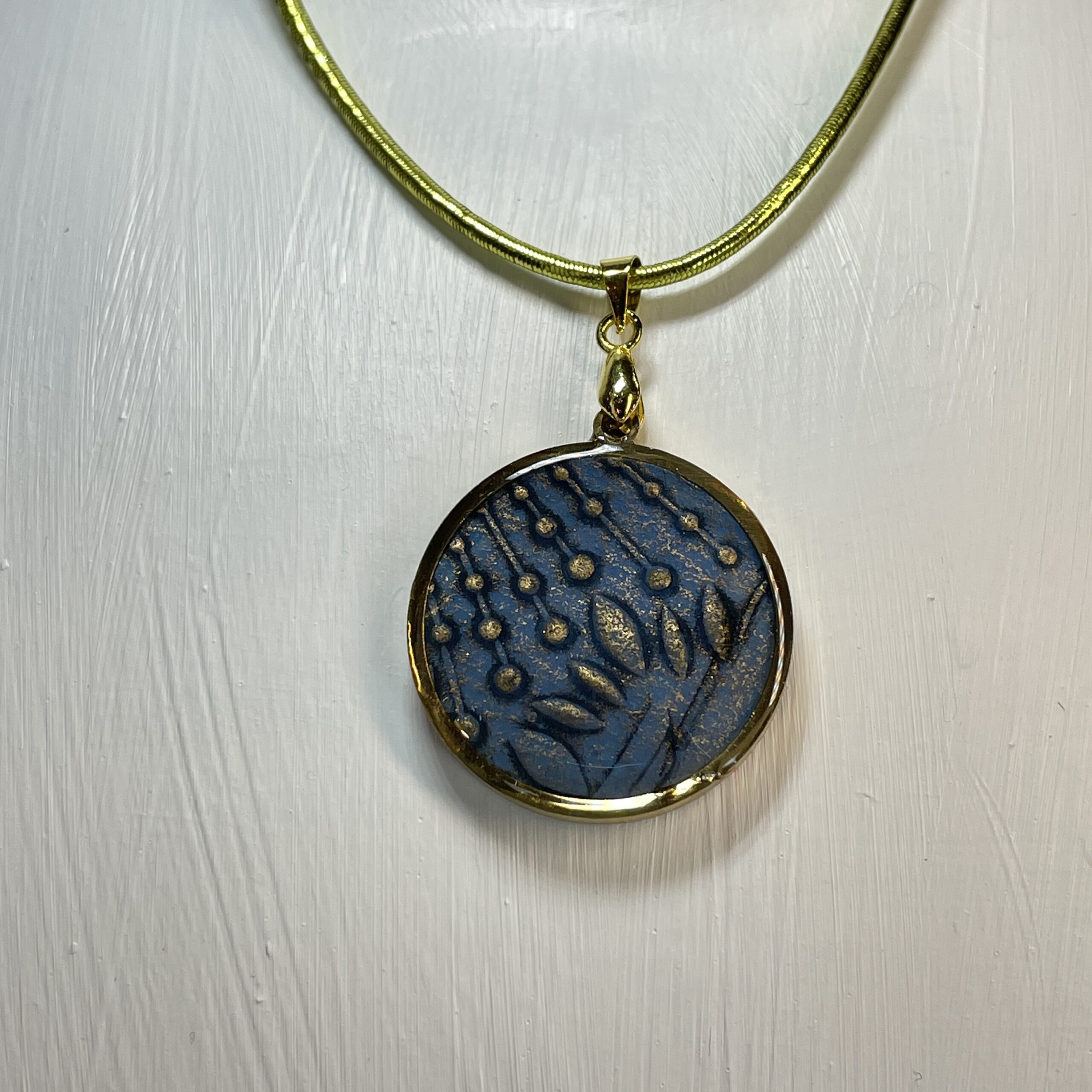 gold and blue pendant hand made in Tauranga
