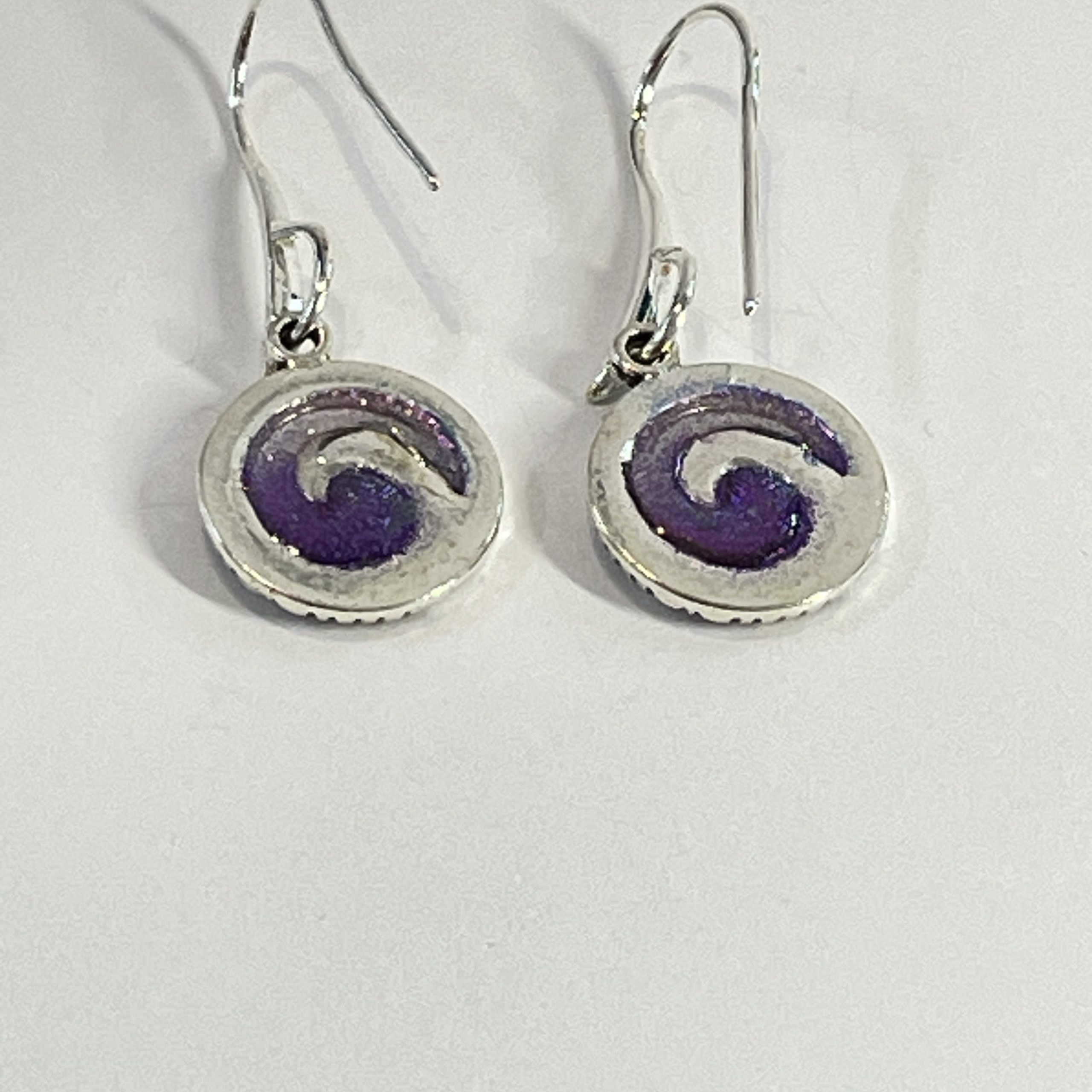 Purple-teal chameleon spiral hand made earrings in NZ” from Bulk EditSilvery red spiral hand made earrings in NZ