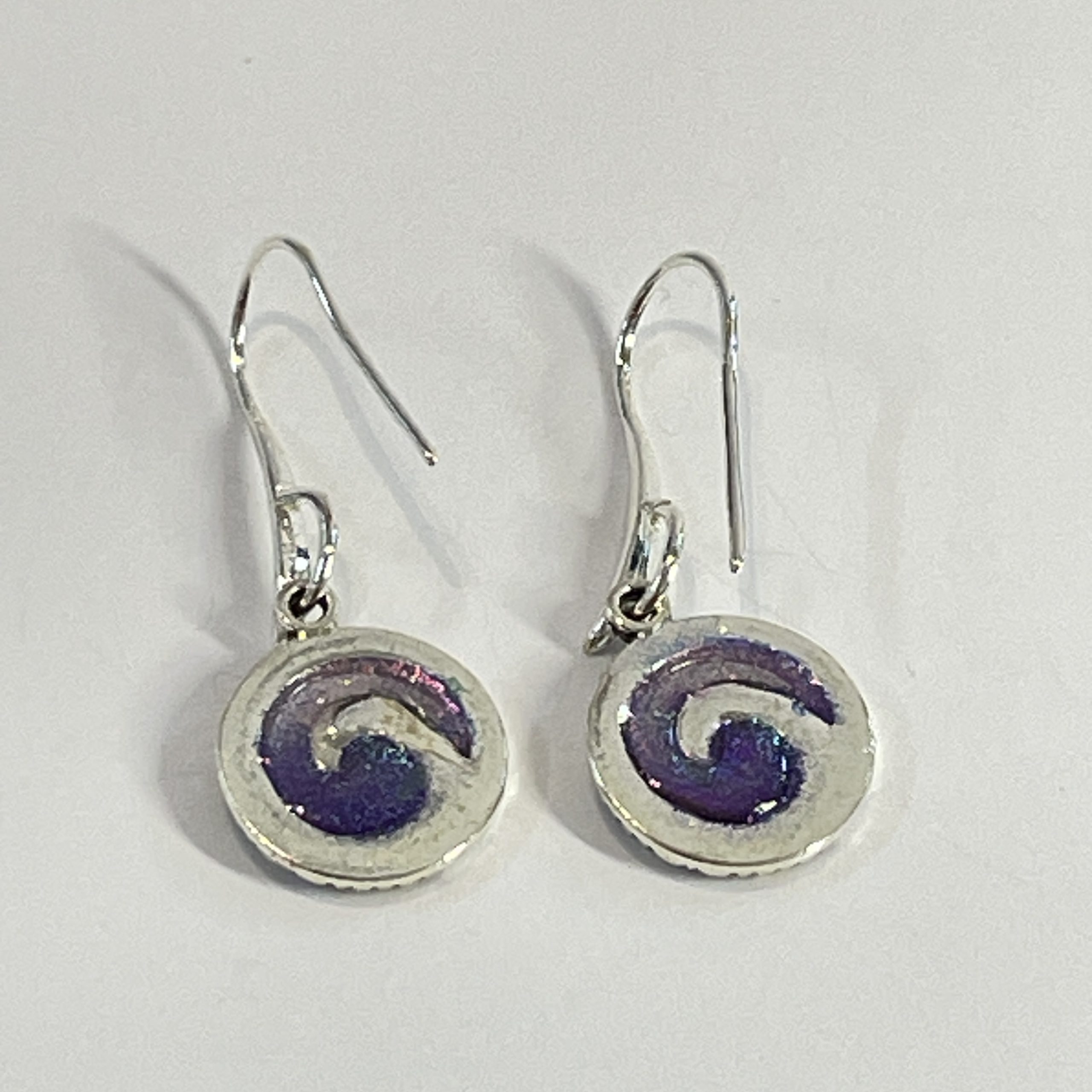 Purple-teal chameleon spiral hand made earrings in NZ” from Bulk EditSilvery red spiral hand made earrings in NZ