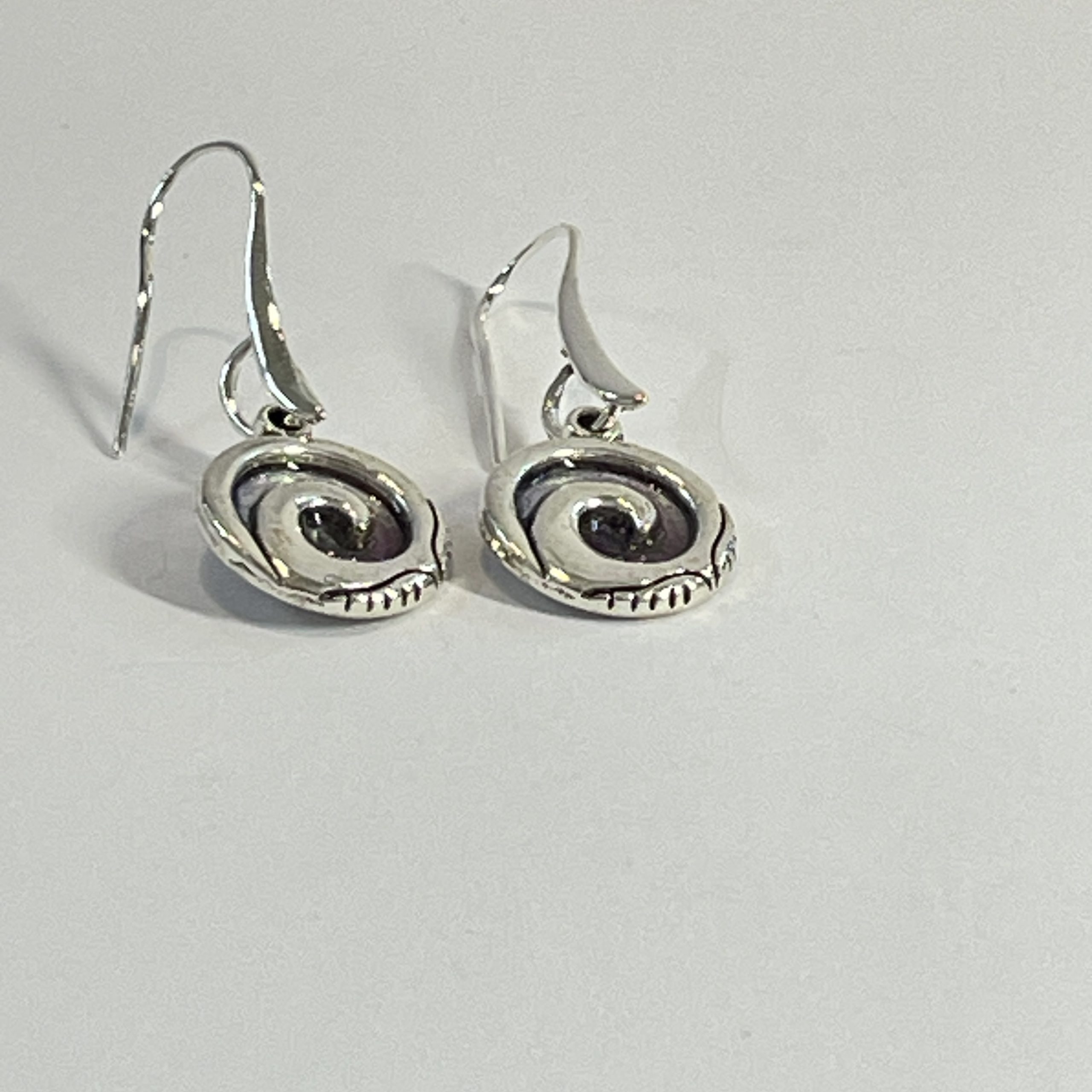 Purple-teal chameleon spiral hand made earrings in NZ” from Bulk EditSilvery red spiral hand made earrings in NZ