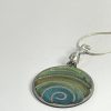 Hand made pendant in multiple green tones