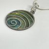 Hand made pendant in multiple green tones