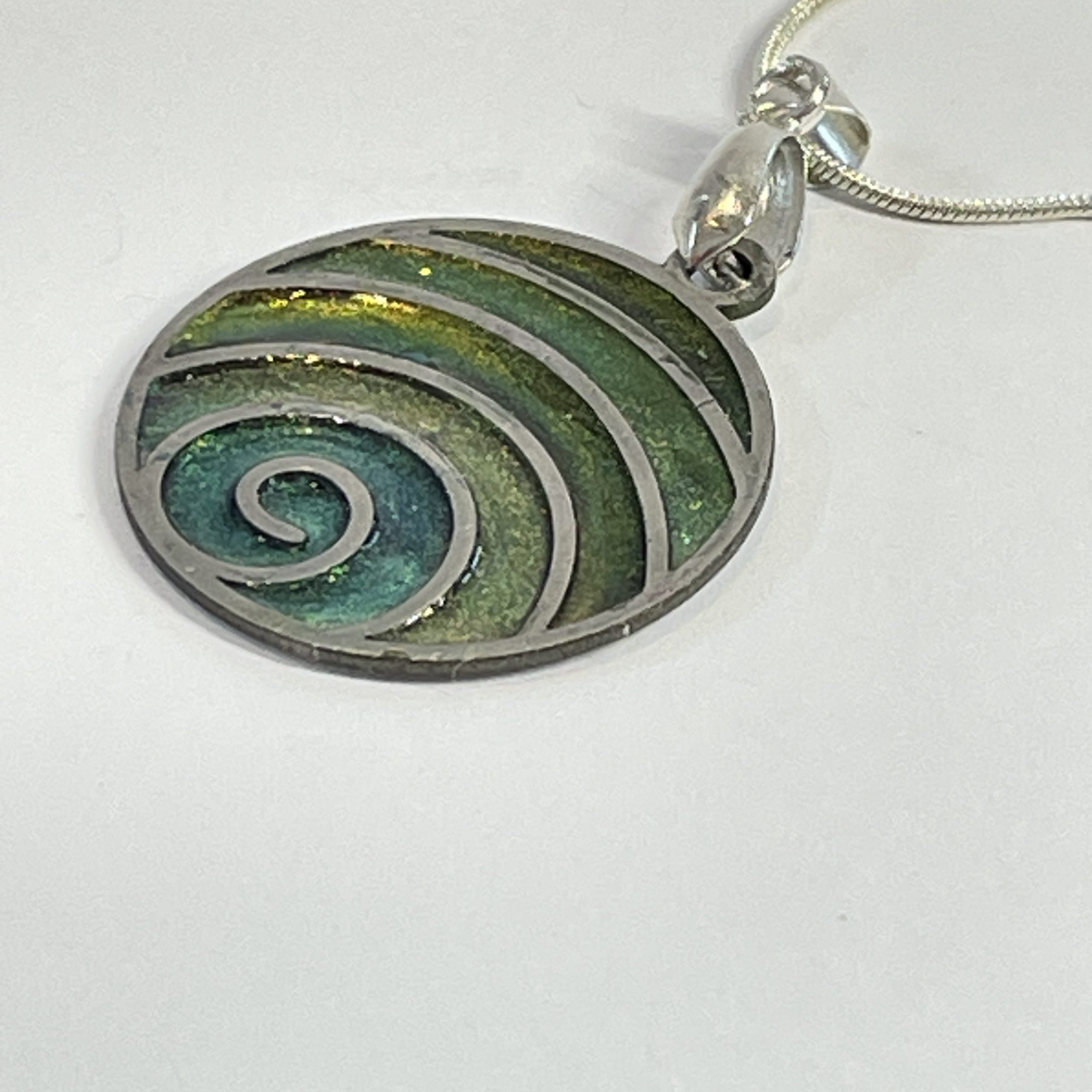 Hand made pendant in multiple green tones