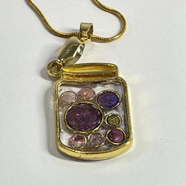 Hand made jar pendant featuring hand crafted sparkly bubbles encased in gold coloured metal