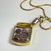 Hand made jar pendant featuring hand crafted sparkly bubbles encased in gold coloured metal