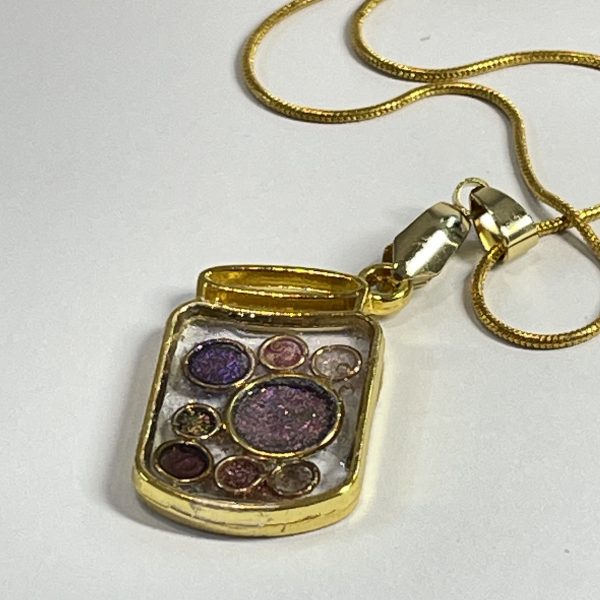 Hand made jar pendant featuring hand crafted sparkly bubbles encased in gold coloured metal