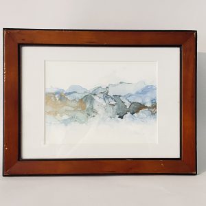 "Mt Maunganui Stormy Surf". Hand painted in Tauranga, this piece has been created with ink on paper featuring blue and green waves reminescent of Mt Maunganui in New Zealand's Bay of Plenty. Metallic gold highlights shine in different lighting conditions.