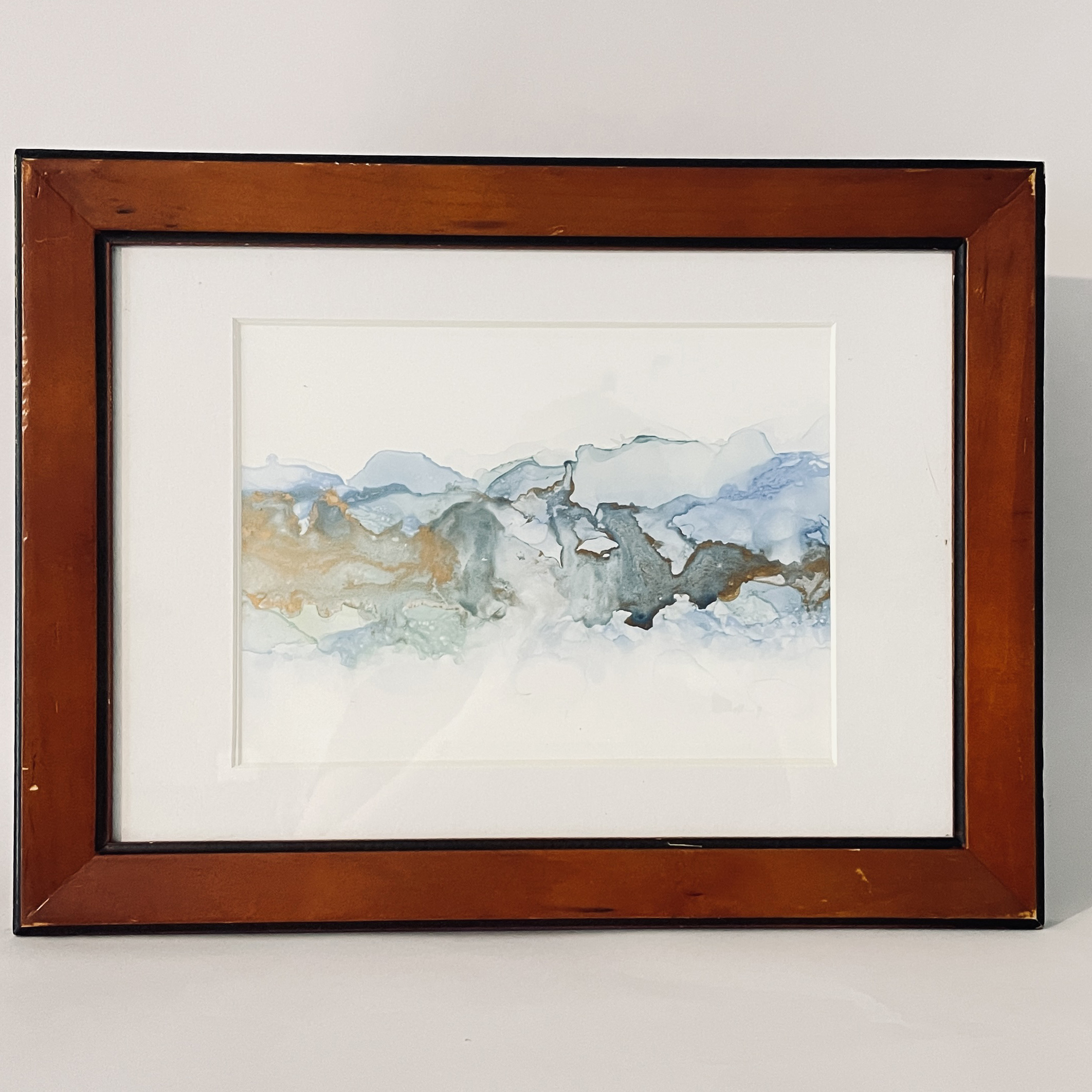 "Mt Maunganui Stormy Surf". Hand painted in Tauranga, this piece has been created with ink on paper featuring blue and green waves "Mt Maunganui Stormy Surf". Hand painted in Tauranga, this piece has been created with ink on paper featuring blue and green waves reminescent of Mt Maunganui in New Zealand's Bay of Plenty. Metallic gold highlights shine in different lighting conditions.