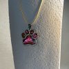 Hand made pendant featuring chameleon colour shift pigment in a silver-coloured pet paw bezel