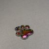Hand made pendant featuring chameleon colour shift pigment in a silver-coloured pet paw bezel