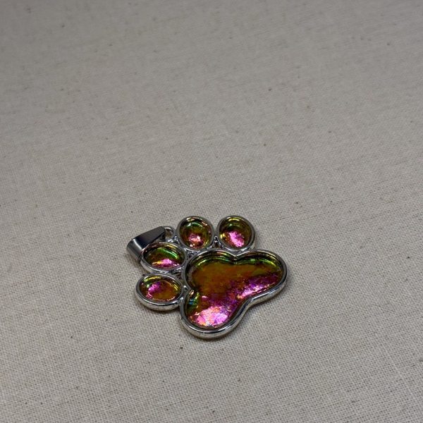 Hand made pendant featuring chameleon colour shift pigment in a silver-coloured pet paw bezel