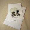 Mount Maunganui greeting card featuring a hand made bicycle with a basket and a black cat