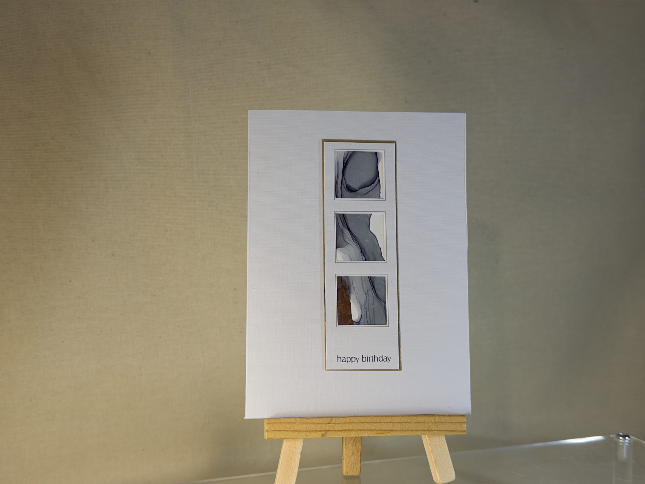 Hand made greeting card featuring grey and copper hand painted art