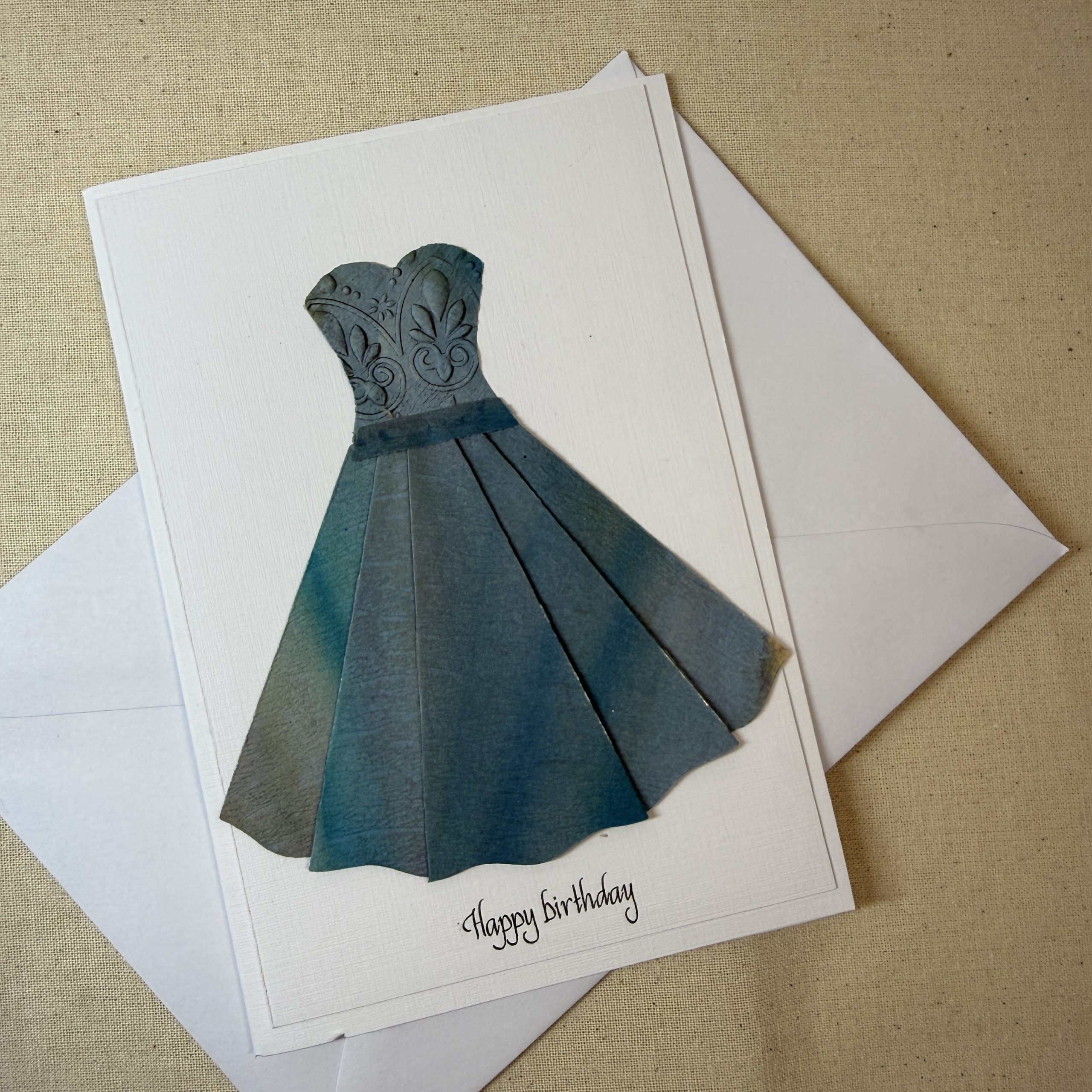 Hand made greeting card featuring floaty embossed and hand painted dress Hand made greeting card featuring floaty embossed and hand painted dress